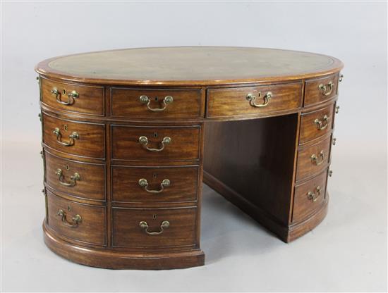 A George III mahogany oval pedestal partners desk, W.4ft 11in. D.3ft 1in. H.2ft 7in.